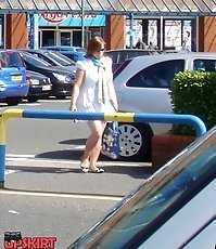 Girl in short skirt caught in street