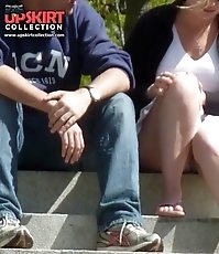 Sneak peek up white skirt of a girlfriend. Spy upskirt