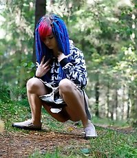 Young cutie empties her bladder in the forest