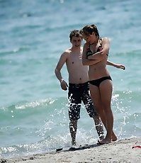 Bikini girls go nude and stretched