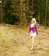 Blonde with tattooed legs pees near forest edge