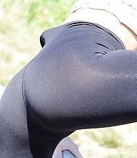 Tight blue jeans on firm butt cheeks
