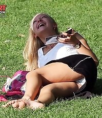 Upskirt hunter is walking in a park