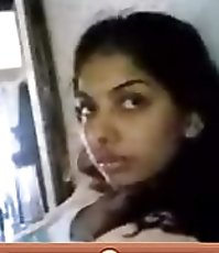 Monique in the black dress sits on a stool at a table, shows legs and a fine ass in cool pantyhose