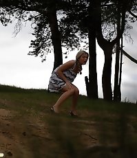 Shameless cute hoochie makes piddle alfresco