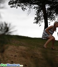 Shameless cute hoochie makes piddle alfresco