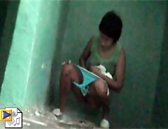 Girls-next-door filmed taking a leak in public WC