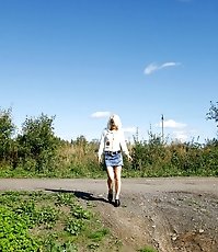 Blonde cutie tinkles on the shoulder of country road
